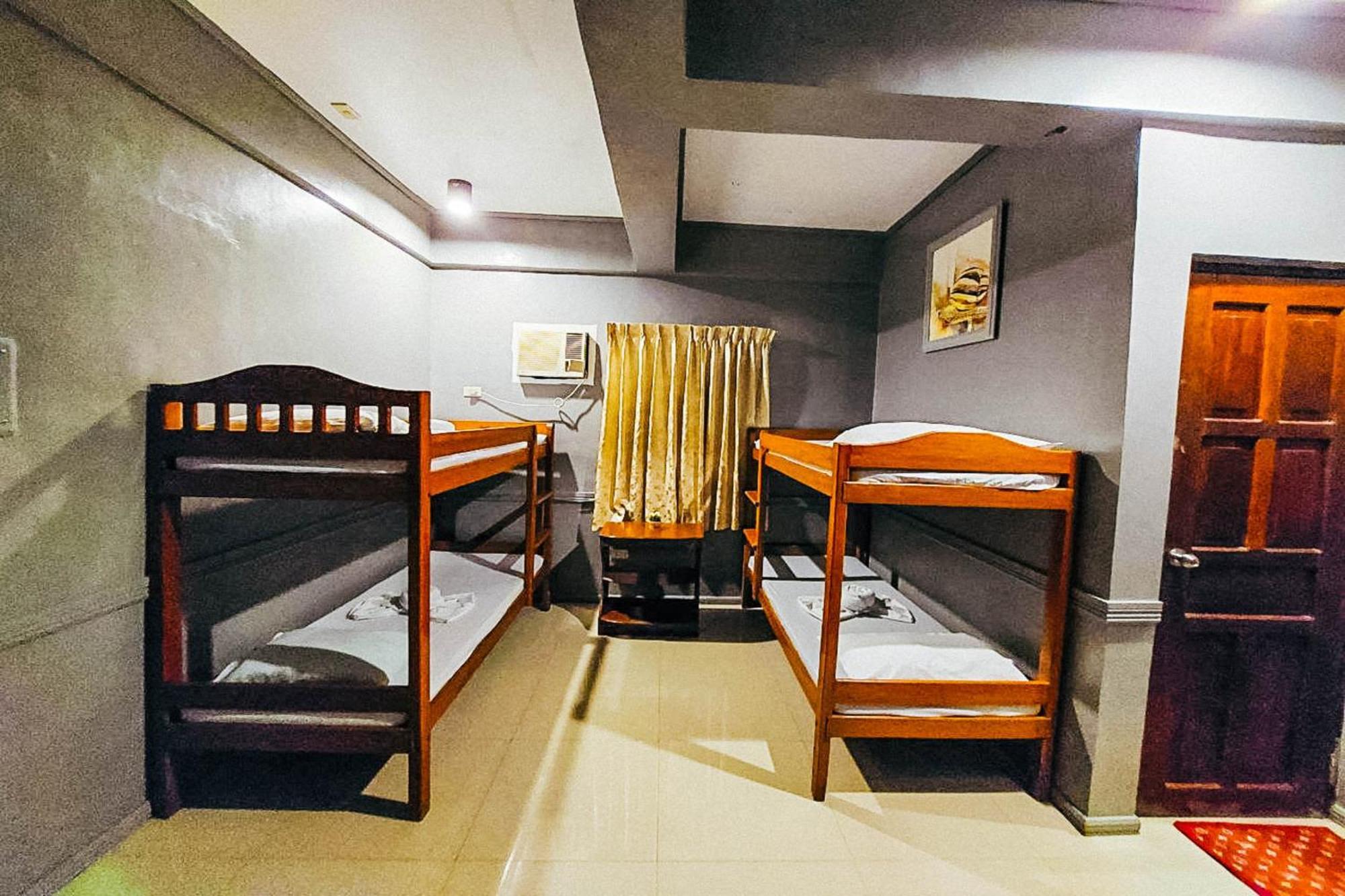 Mbg Travellers Inn Powered By Cocotel Пуэрто-Принцеса Номер фото
