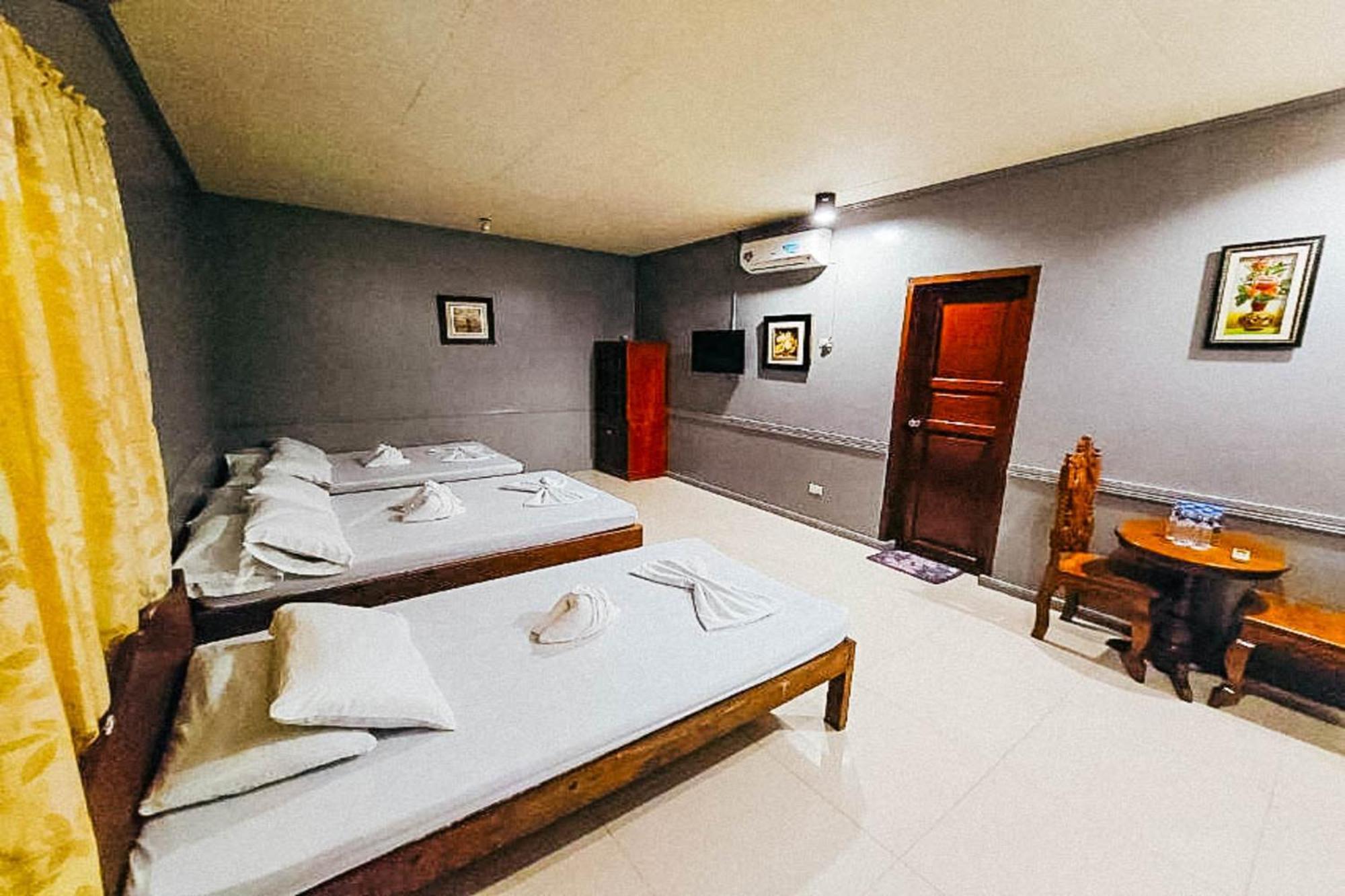 Mbg Travellers Inn Powered By Cocotel Пуэрто-Принцеса Номер фото